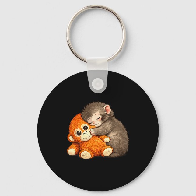 Punch the monkey cuddling stuffed animal meme keychain (Front)