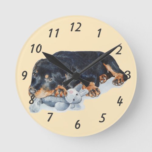 puppy cuddling teddy bear rottweiler dog round clock