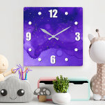 Purple Abstract Watercolor Gold Glitter Stars Bold Square Wall Clock<br><div class="desc">Tiny gold stars twinkle on a purple and dark blue abstract watercolor background. Enliven up your favorite room with this stunning, vibrant wall clock. Your choice of a round or square clock face. Makes a great housewarming gift! You can easily personalize this wall clock. Please message me with any questions...</div>