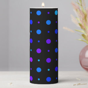 purple and blue polka dots on black pillar candle