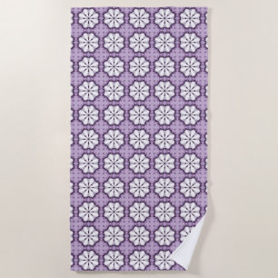 Purple and white floral patterned beach towel