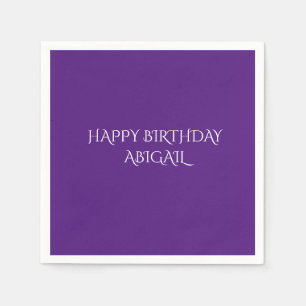 Purple birthday napkins with personalized name.