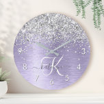 Purple Brushed Metal Silver Glitter Monogram Name Round Clock<br><div class="desc">Easily personalize this trendy chic round clock design featuring pretty silver sparkling glitter on a purple brushed metallic background.</div>