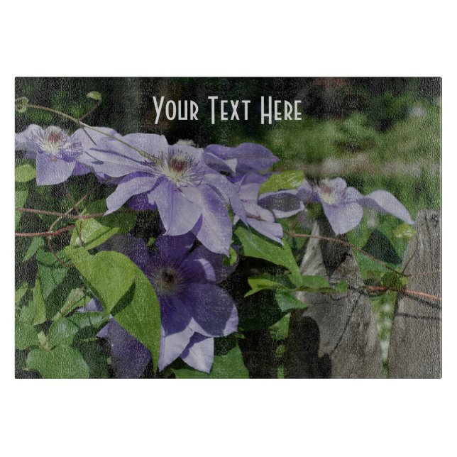 Purple Clematis Flowers On Fence Nature Cutting Board (Front)