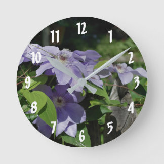 Purple Clematis Flowers On Fence Round Clock