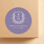Purple Crest Floral Modern Monogram Wedding  Classic Round Sticker<br><div class="desc">Elevate your wedding details with our Purple Crest Floral Modern Monogram Wedding Classic Round Sticker. Featuring a stylish floral crest design in rich purple tones paired with a clean, modern monogram, this versatile sticker adds a sophisticated touch to invitations, favors, or thank you cards. The elegant blend of botanical elements...</div>