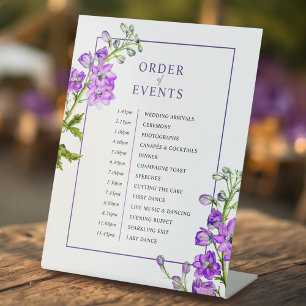 Purple delphinium botanical wedding order of event pedestal sign