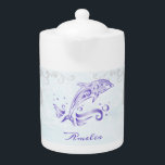 Purple Dolphin Personalized Teapot<br><div class="desc">Enjoy your tea with a Purple Dolphin Personalized Teapot.  Teapot design features a vibrant metallic dolphin against a muted seascape adorned elegant scrolls with an area to personalize with your name.  Additional gift items available with this design as well as a variety of colors.</div>