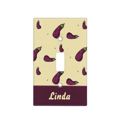 Purple eggplants on yellow light switch cover