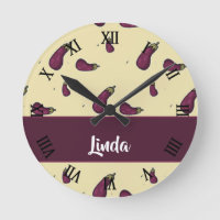 Purple eggplants on yellow round clock