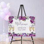 Purple Floral Brunch and Bubbly Welcome Easel Foam Board<br><div class="desc">Brunch and Bubbly Welcome Sign with purple floral design and handwritten script typography. The template is set up for you to personalize for your bridal shower or other brunch and bubbly occasion. This feminine watercolor design has purple flowers, buds and blooms and a dash of greenery and clinking champagne glasses....</div>