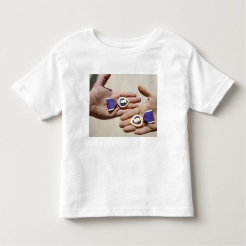Purple Heart recipients display their medals Toddler T_shirt