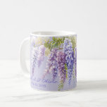 Purple lavender watercolor floral wisteria lilac  coffee mug<br><div class="desc">This watercolor painting captures the delicate beauty of purple wisteria in full bloom. The petals, rendered in varying shades of soft purple and pink, unfurl gracefully, showcasing the flower's intricate layers and natural elegance. The translucent quality of the watercolor medium enhances the wisterias ethereal charm, with subtle washes and gradients...</div>