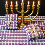 Purple Menorah on white background Wrapping Paper<br><div class="desc">This elegant Jewish wrapping paper showcases a repeating pattern of purple Stars of David, each centered with a golden Hanukkah menorah glowing with vibrant candles. The layered star motif, blending lavender and deep violet tones, adds depth and warmth against the crisp white background. The menorah’s flickering lights in shades of...</div>