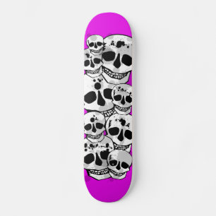 Purple paint splatter skulls black skateboard deck