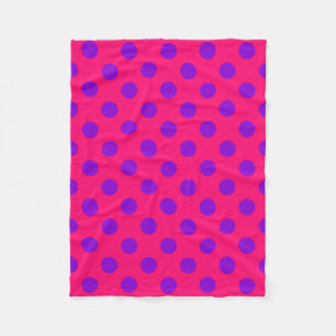 Purple polka dots on cerise fleece blanket