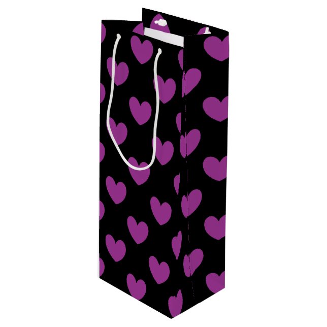 Purple polka hearts on black wine gift bag (Front Angled)