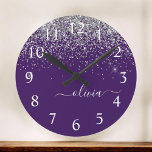 Purple Silver Glitter Girly Glam Monogram  Round Clock<br><div class="desc">Purple and Silver Sparkle Glitter Brushed Script Monogram Name Clock. This makes the perfect sweet 16 birthday,  wedding,  bridal shower,  anniversary,  baby shower or bachelorette party gift for someone that loves glam luxury and chic styles.</div>