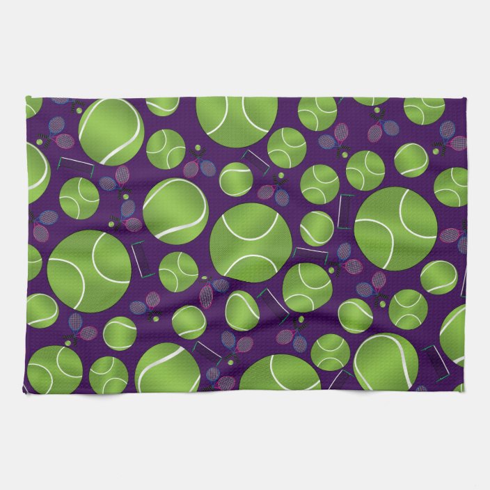 Purple tennis balls rackets and nets towel