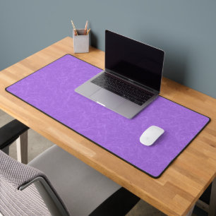 Purple textured surface with swirling pattern desk mat