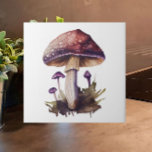 Purple Watercolor Woodland Mushroom Cottagecore Ceramic Tile<br><div class="desc">Add the charm and whimsy of the popular Cottagecore aesthetic to your home with this beautiful watercolor woodland mushroom ceramic tile. In tones of purple, brown and green, the motif will add a cozy feel to your kitchen backsplash or counter, bathroom, fireplace or other tiled space. Also makes a great...</div>