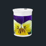 Purple & Yellow Pansy Porcelain Pitcher<br><div class="desc">Nothing could be prettier than a simple purple and yellow pansy growing in a cottage garden. With beautiful,  velvety petals,  the pansy flower is growing in old-fashioned iron planter to create a stunning floral design.</div>