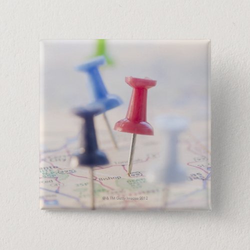 Pushpins in a map pinback button