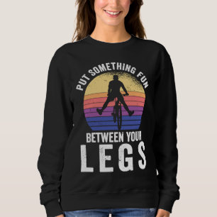 Put something fun between your legs for a cycling  sweatshirt