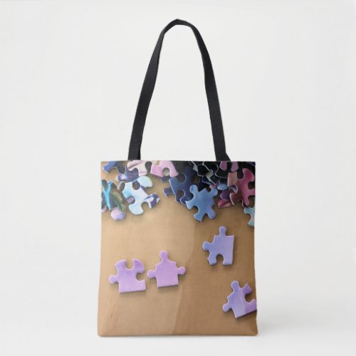 Puzzle pieces on an all over print tote bag