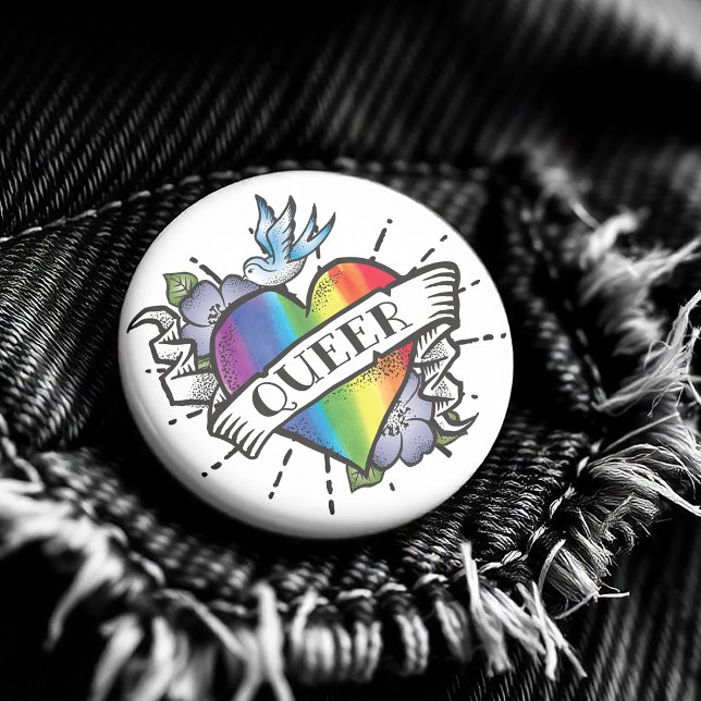 Queer Heart Tattoo Button ( Featuring a realistic image of a rainbow colored heart with Queer proudly written on the front. )