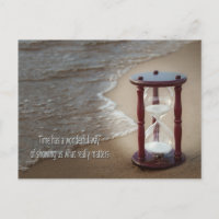 Quote with sand timer on beach