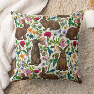 Rabbits and wildflowers throw pillow