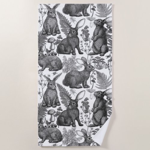 Rabbits and woodland flora 2 Beach Towel