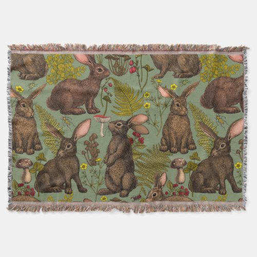 Rabbits and woodland flora Throw Blanket
