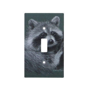 Raccoon climbing tree green light switch cover
