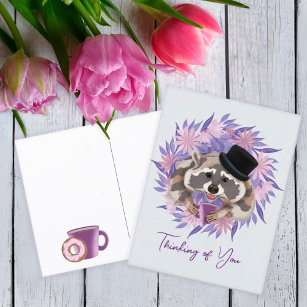Raccoon in a hat with a mug of coffee.   postcard
