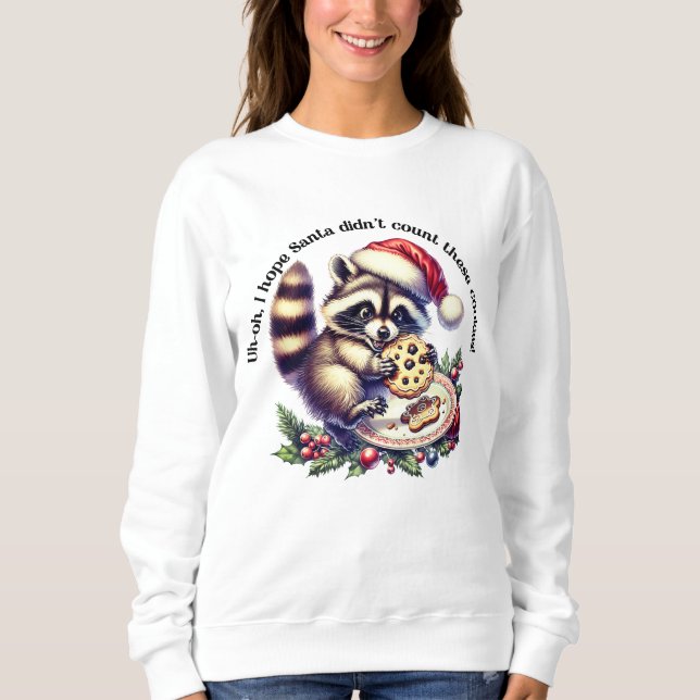 Raccoon in a Santa hat enjoys cookies at Christmas Sweatshirt (Front)