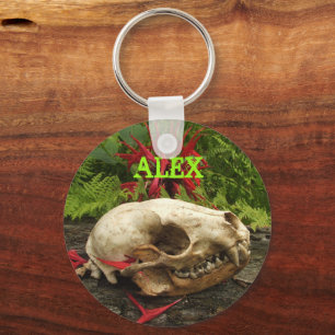 Raccoon skull old log with ferns and red Monarda Keychain