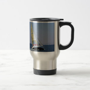 Racing yacht from behind. travel mug