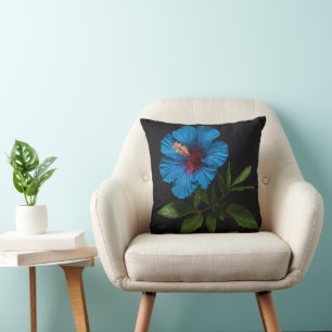 "Radiant Blue: Hibiscus Flower Against On Black  Throw Pillow