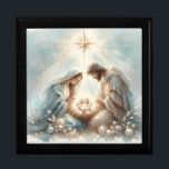 Radiant Holy Family Nativity Scene Gift Box<br><div class="desc">This serene Holy Family nativity design centers on a radiant newborn beneath a brilliant guiding star, surrounded by gentle celestial glow and soft watercolor light that evokes reverence and peaceful Christmas wonder. Mary and Joseph lean close in quiet devotion, their flowing robes painted in calming pastel blues and warm neutrals...</div>