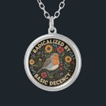 Radicalized by Basic Decency Birds lovers Silver Plated Necklace<br><div class="desc">Embrace the quiet rebellion of kindness with this beautifully illustrated design. Featuring a charming European Robin nestled among vibrant sunflowers, poppies, thistles, and delicate bluebells, this artwork blends vintage botanical charm with a powerful modern message. The bold text “RADICALIZED BY BASIC DECENCY” is a witty, sarcastic, and deeply resonant statement...</div>