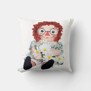 rag doll with daisy bouquet throw pillow