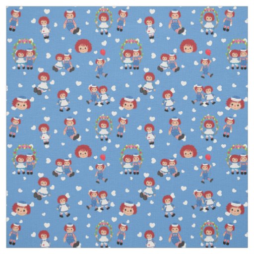 Raggedy Ann and Andy on Falling Hearts on Blue Fabric