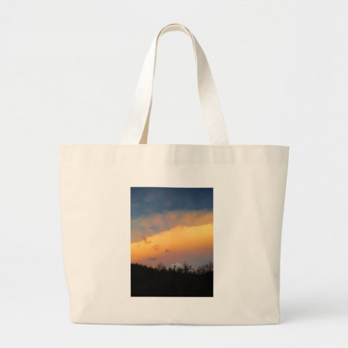 Rainbow colored clouds large tote bag