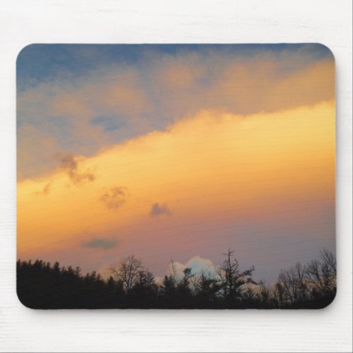 Rainbow colored clouds mouse pad