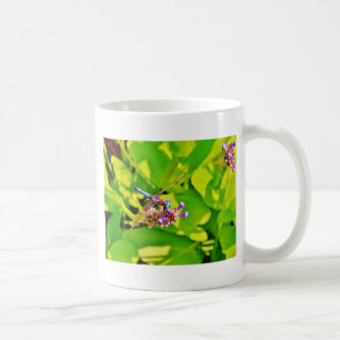 Rainbow colored Dragonfly on a purple pink flower Coffee Mug