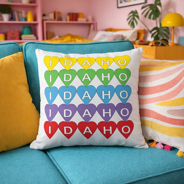 Rainbow Idaho State Love Design Throw Pillow (A pillow with a rainbow heart pattern that says Idaho)