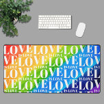 Rainbow LGBT Gay Pride  Desk Mat<br><div class="desc">This colorful desk mat is decorated with a watercolor rainbow background and a Love is Love pattern in stylish white typography.</div>