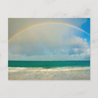 Rainbow over ocean postcard